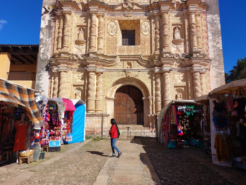 Market stalls line the entrance to the (now closed) Church of Santo Domingo de Guzman