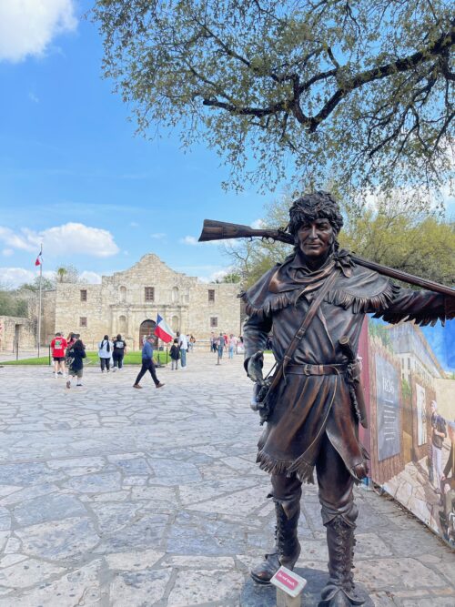 Davy Crockett statue in front of the Alamo Church in San Antonio.