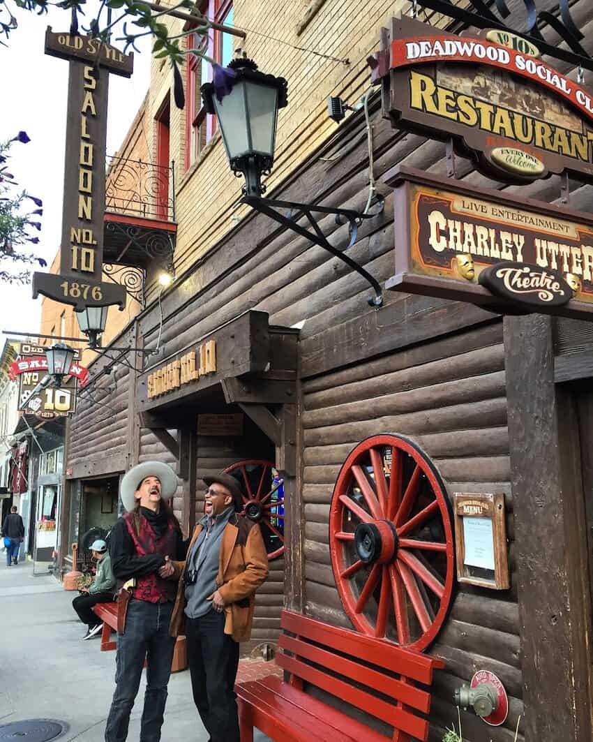 Western historian Sid Wilson, left, with a re-enactor who portrays Wild Bill Hickok at the No. 10 Saloon in Deadwood, named after the saloon where Wild Bill was shot. It's not unusual to see people wearing guns in Deadwood.