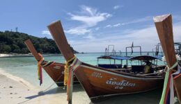 Colourful longtail boats on picturesque Pattaya Beach.