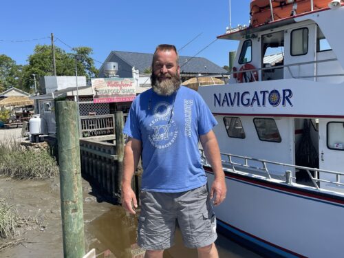 Captain Robert Taylor charters boats for deep-sea fishing and dolphin cruises from the docks outside his restaurant in Calabash.
