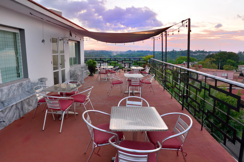 The large outdoor deck at Chateau Blanc affords sweeping views of the Cuban countryside.