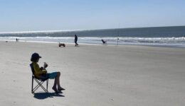 A lone guitarist on the beach at Sunset Beach, Brunswick Islands NC. Anne Braly photos.