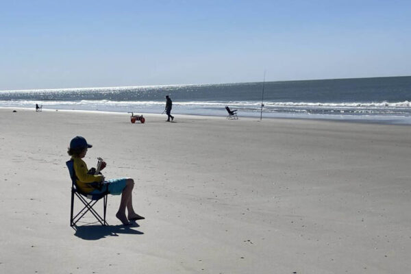 A lone guitarist on the beach at Sunset Beach, Brunswick Islands NC. Anne Braly photos.