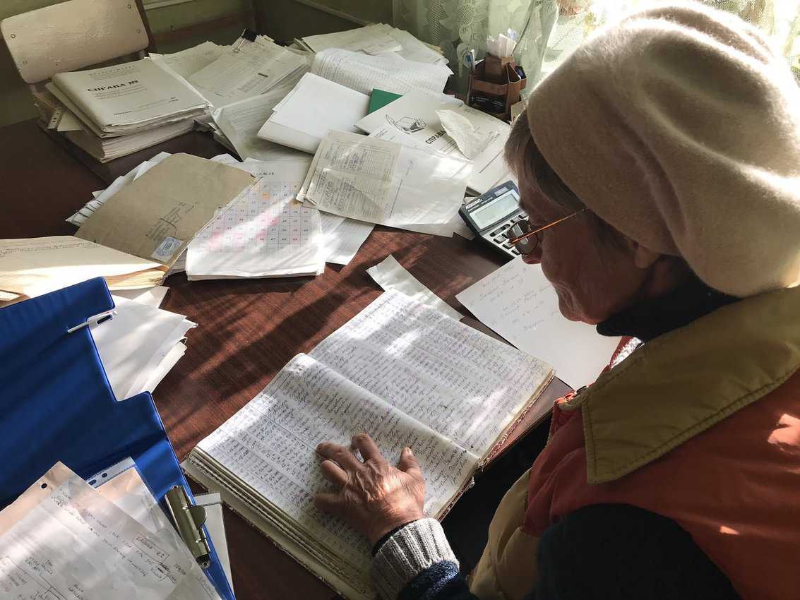 Genealogical Travel: Finding Your Family Roots 5 One of their customers enjoys browsing through the old records.