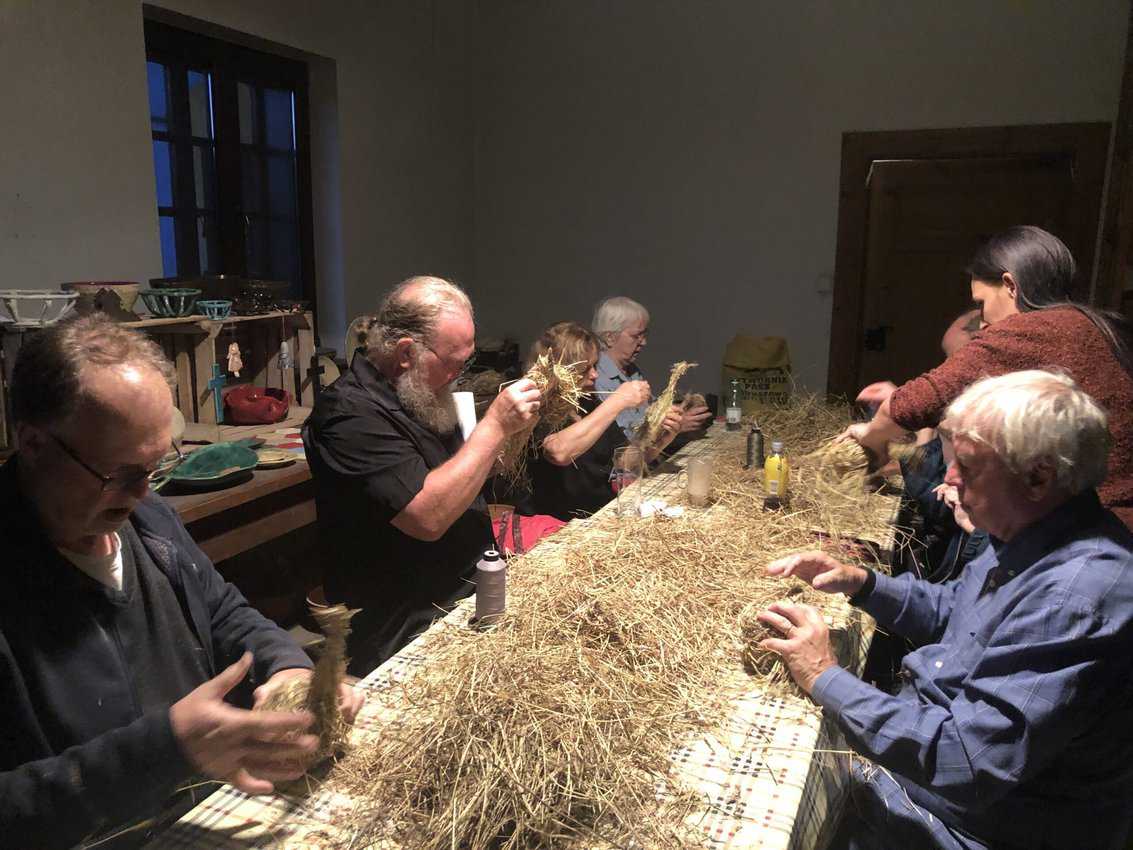 Genealogical Travel: Finding Your Family Roots 10 A group of Americans is participating in a workshop to learn how to make hay ornaments