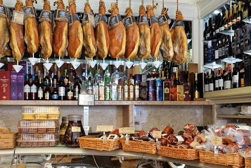 Old shops like Manteigaria Silva share the streets with modern international stores