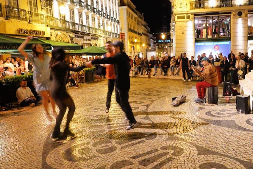Strangers dancing at 10:30 to a street artist