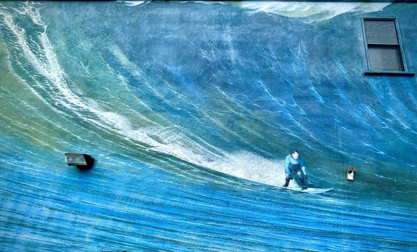 Mural in Half Moon Bay of surfers in California.
