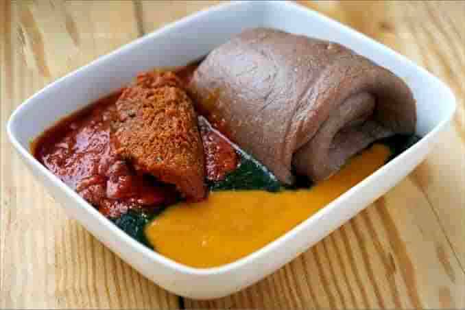 A common meal among Lagosians made from yam flour, jute leave, bean soup and meat