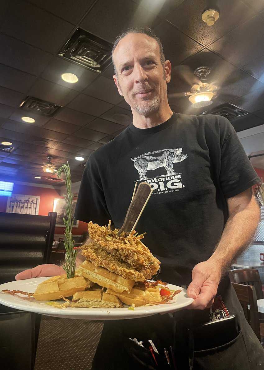 The Plaza Hotel and Casino Awaits 2 A server delivers chicken and waffles to the table at Hash House A Go Go.