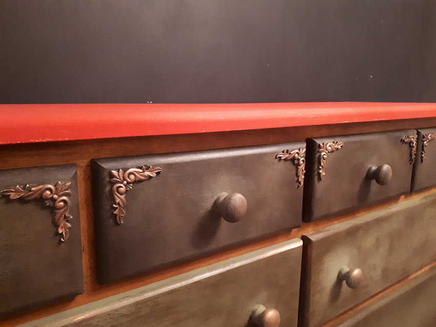 A commissioned handmade chest of drawers created by three artisans - a carpenter, a painter and a wood-smith who carved the decorative moulds.