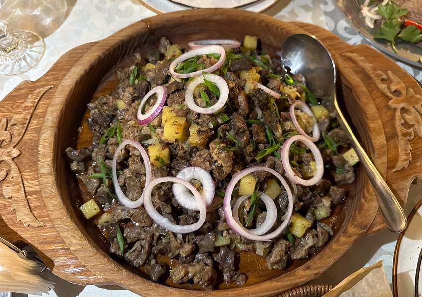 Kuyrdak is a traditional Kazakh stew made with horse meat, onions, peppers, and potatoes.