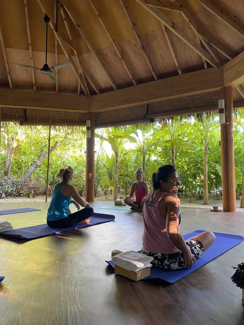 Sunrise yoga at Mirihi Island Resort.