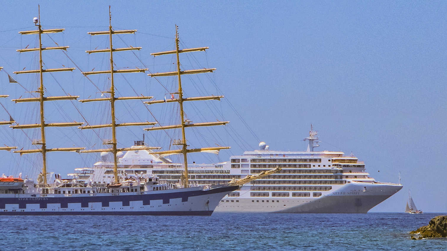 The Royal Clipper next to a much larger cruise ship in the Mediterranean.