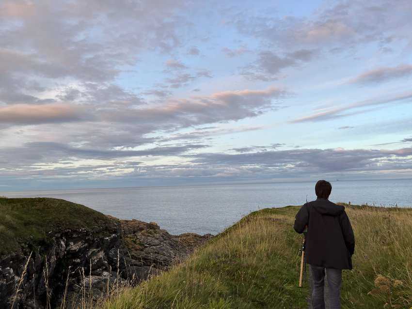 Navigating the Scottish Highlands by Car 2 Walking through a cliff on the coastline of Aberdeen.