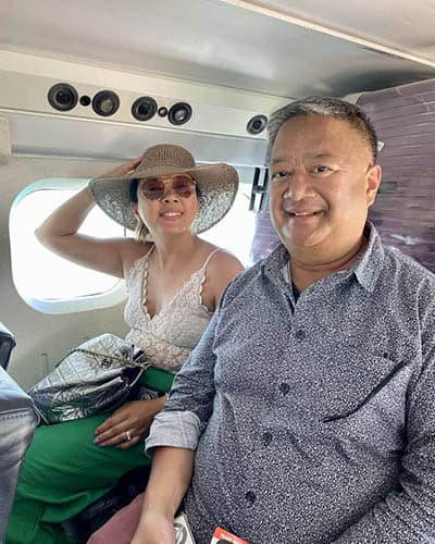 Excited travelers aboard the seaplane taking them to Mirihi Island Resort in The Maldives.