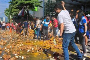 Thaipusam Festival in Penang, Malaysia Coconut breaking is a splatter-filled spectacle during Thaipusam. Teh Chin Liang photos