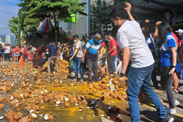 Coconut breaking is a splatter-filled spectacle during Thaipusam. Teh Chin Liang photos