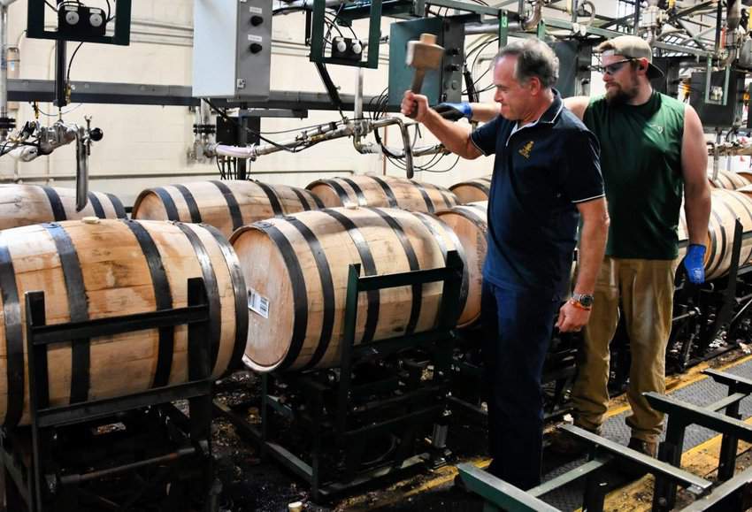 Horses, Bourbon, and More in Central Kentucky 6 Tab Hauser sealing bourbon barrell at Buffalo Trace, Central Kentucky, Lexington