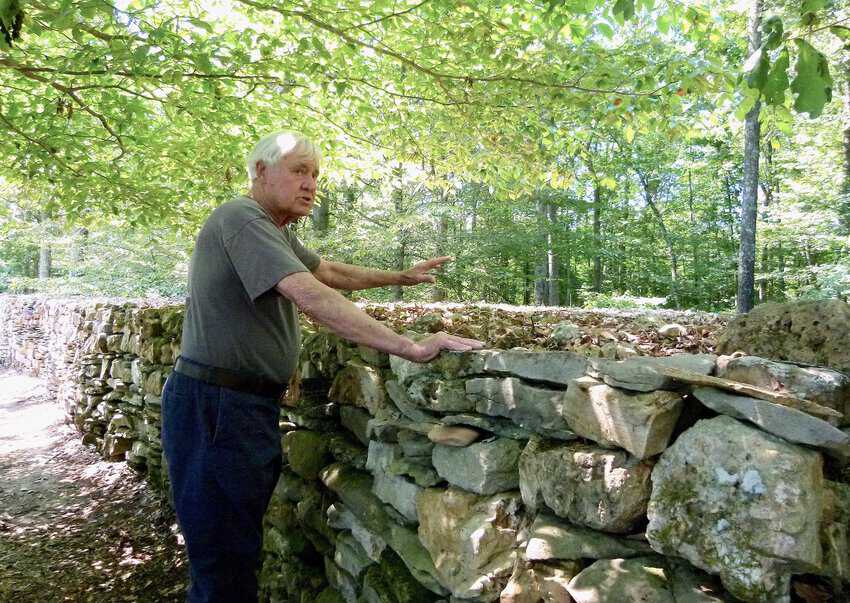 Tom Hendrix tells how and why he constructed the mile-long wall in a 2015 photo.