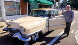 Tad Pierson with his 1955 Cadillac in front of Sun Studio hosting an American Dream Safari Tour of Memphis