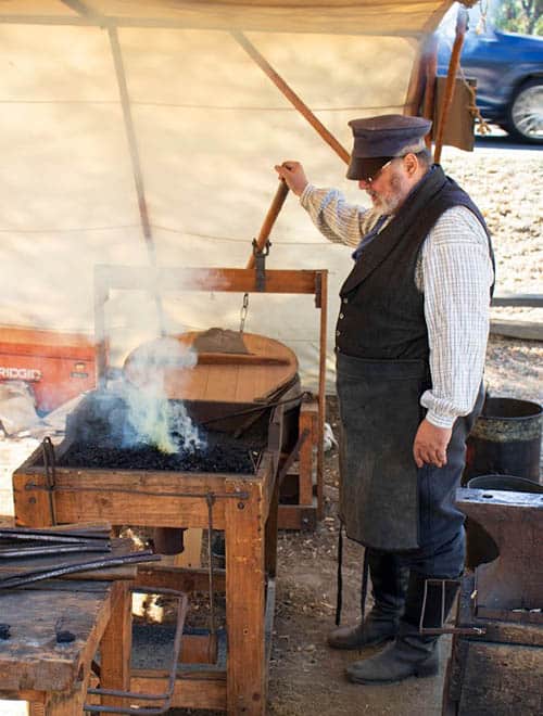 Living the Gold Rush in Coloma, California 7 The blacksmith hard at work in the heat from the forge and sun.