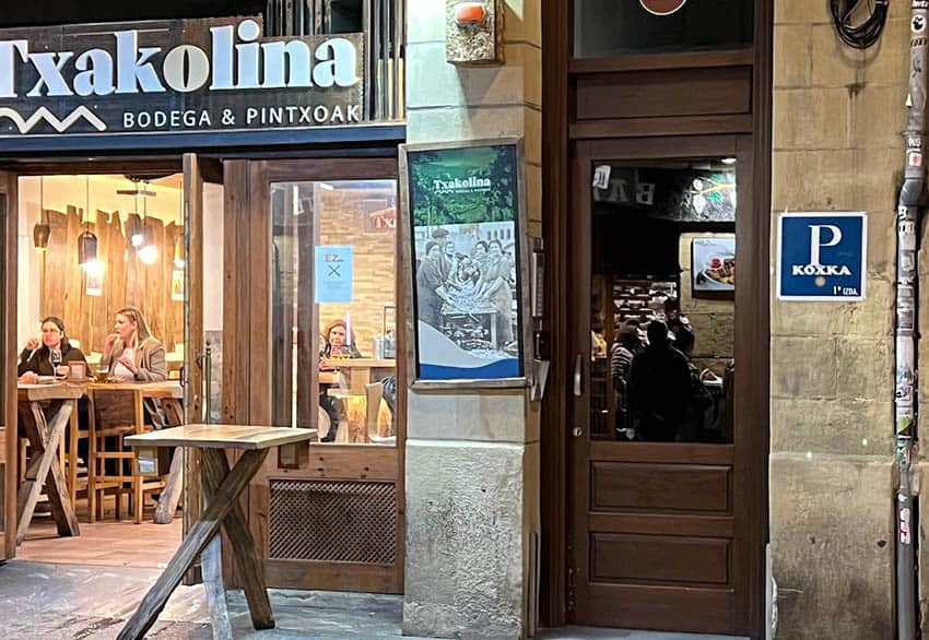 The Solo Traveler’s Portable Wellness Kit: What to Pack Beyond First Aid 1 On the left Txakolina Bodega. Two feet to right the entrance to the staircase up to Pension Koxka. Convenient for a solo woman traveler who enjoys her Crianza.