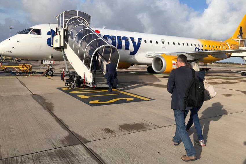 Boarding a plane on the island of Guernsey.