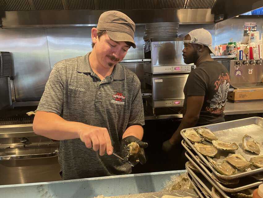 Panama City Beach's Top Shuckers 2 Honor Allen, four-time National Oyster Shucking champion, shucks oysters at Dat Cajun Place in Panama City Beach.
