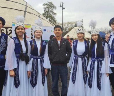 The writer, Teh Chin Liang, poses with a group of costumed Nowruz revelers