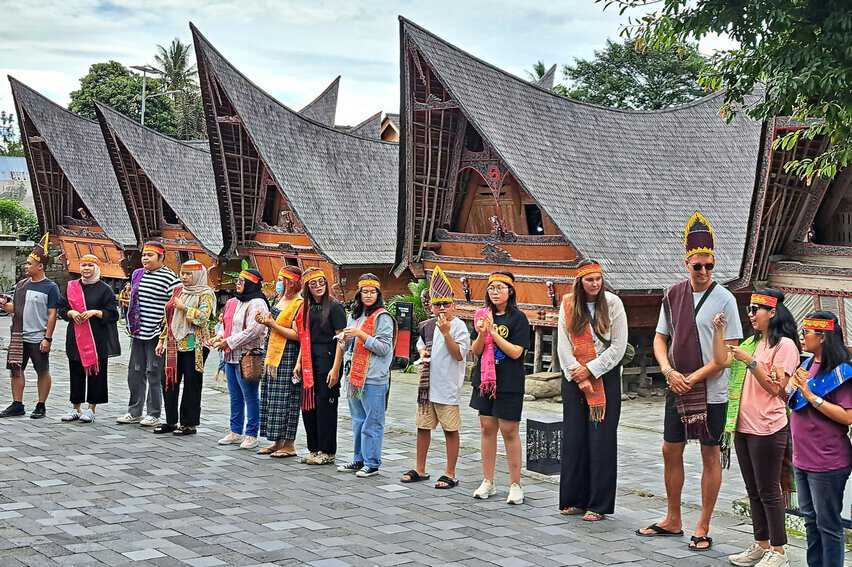 Lake Toba Indonesia: The World's Largest Crater Lake 6 Tourists dressed in Batak attire