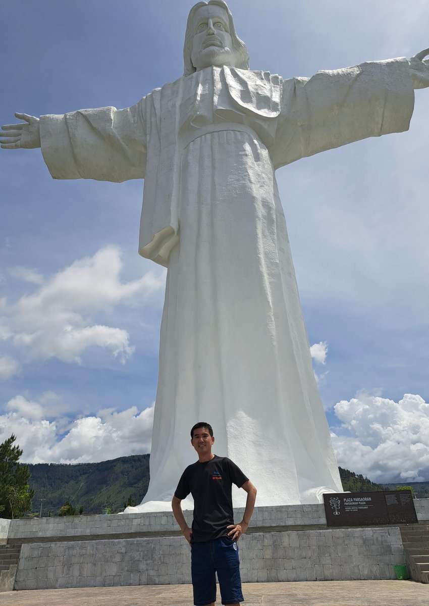 Lake Toba Indonesia: The World's Largest Crater Lake 7 The author, Chin Liang, poses in front of the Jesus statue