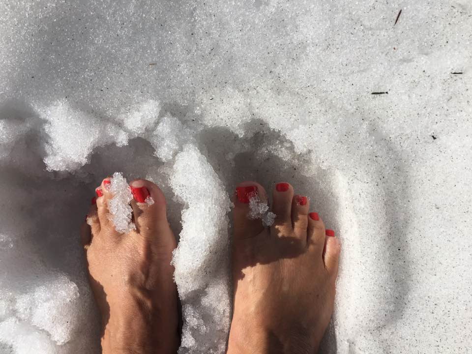 Lassen Volcanic National Park: California’s Least-Visited 2 The writer with bare feet in the snow. Photo by Noreen Kompanik