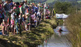 The spectators root for the competitor in the bog (Photos by Peter Barnett)