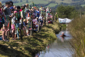 The spectators root for the competitor in the bog (Photos by Peter Barnett)
