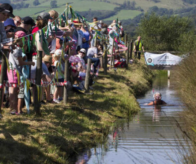 The spectators root for the competitor in the bog (Photos by Peter Barnett)