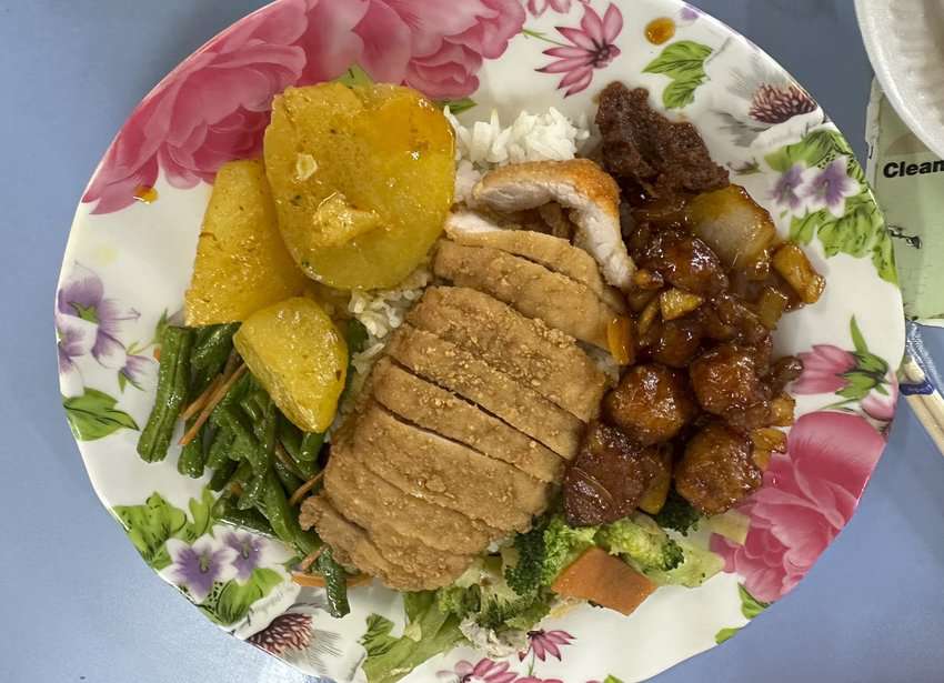 Chinese focused eats include chicken, veggies, rice, and sweet and sour pork. Photo by Donnie Sexton