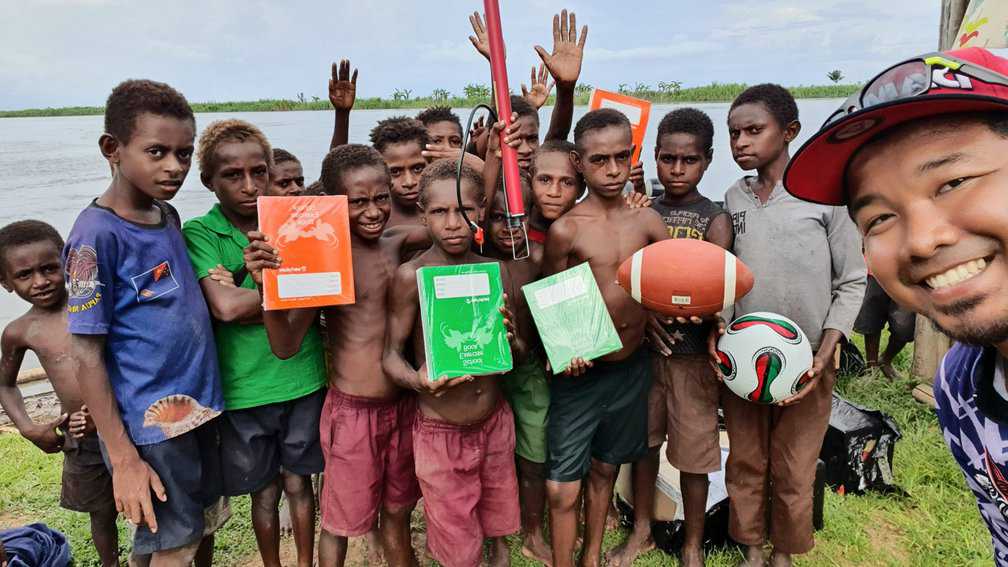 Chasing Giants: Sport Fishing in Papua New Guinea 10 A village visit and donations to local kids