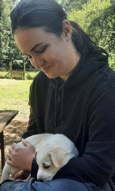 Aurora Austral: Husky Farm in the Chilean Mountains 3 The author with a husky/lab cross puppy. Photo by David Palz