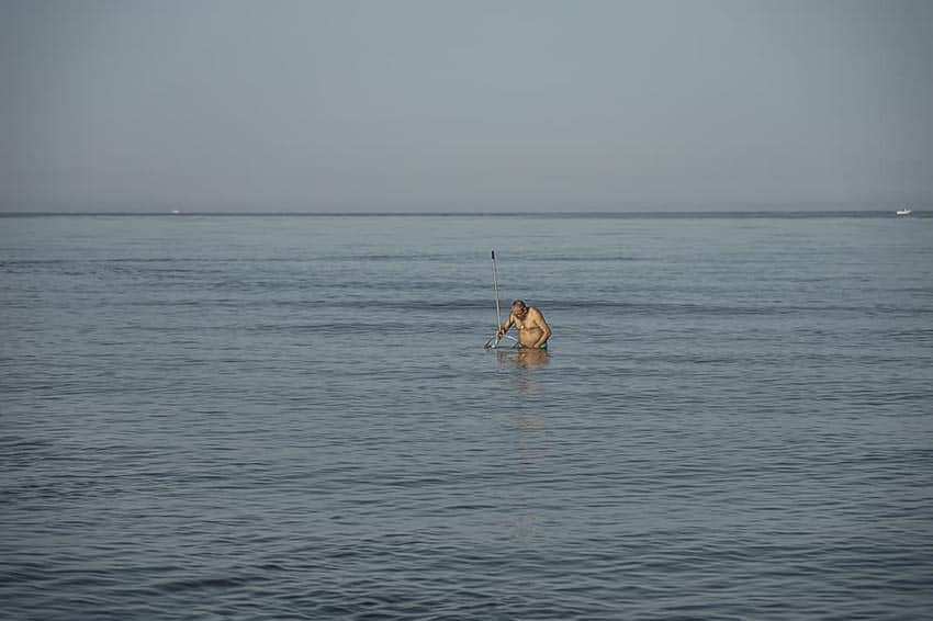 Clamming before the crowds come in the early morning in Fregene.