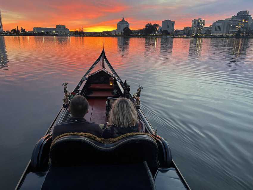 Oakland: Discover the City's Unique Neighborhoods and Cultural Heritage 13 Beautiful sunset over Lake Merritt, capturing a romantic gondola ride with vibrant colors reflecting on the water.