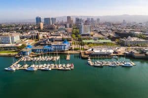 Oakland: Discover the City's Unique Neighborhoods and Cultural Heritage Stunning aerial view of Jack London Square, showcasing the vibrant waterfront, bustling docks, and surrounding urban landscape.