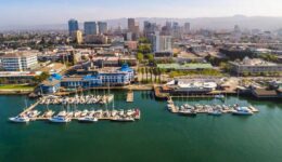 Stunning aerial view of Jack London Square, showcasing the vibrant waterfront, bustling docks, and surrounding urban landscape.