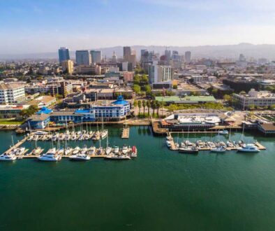 Stunning aerial view of Jack London Square, showcasing the vibrant waterfront, bustling docks, and surrounding urban landscape.