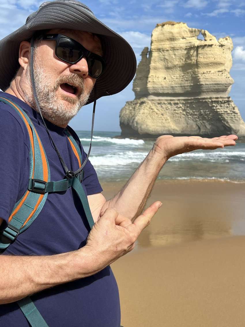 My mate balances one of the surreal limestone rock formations in the palm of his hands at the Gibson Steps Beach.