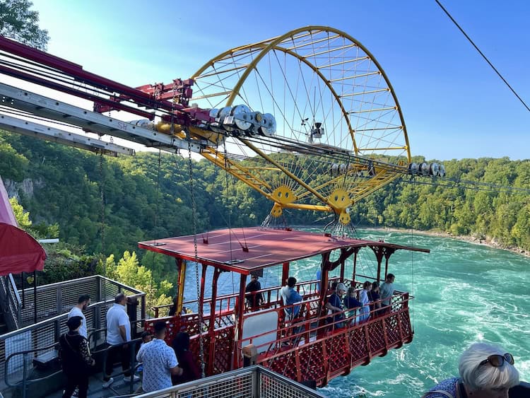 a group of people boarding the Whirlpool Aero Car 