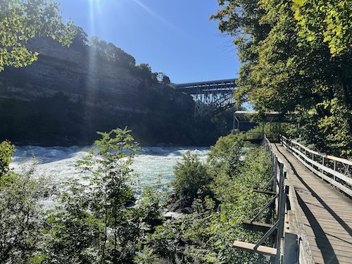 a bridge over Niagara River above rushing rapids. 