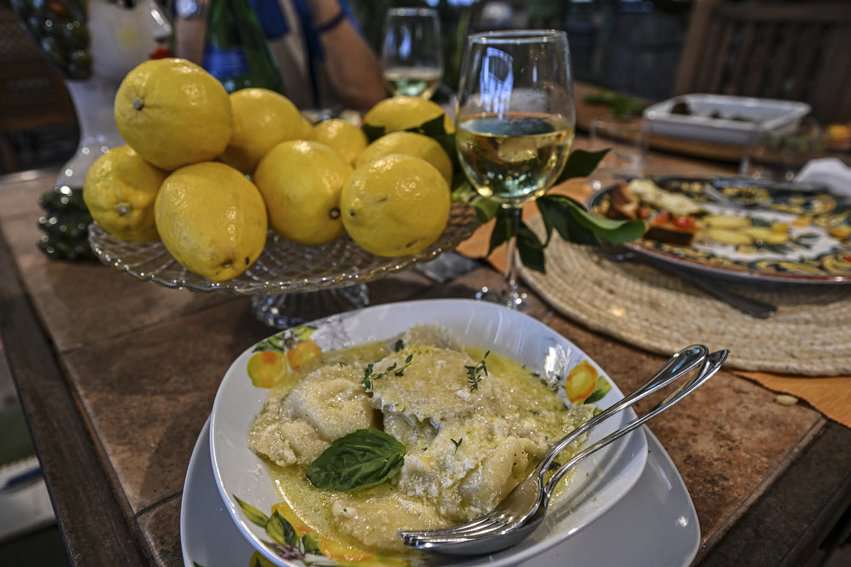 Homemade ricotta-stuffed ravioli is served with a delicate lemon-butter sauce.