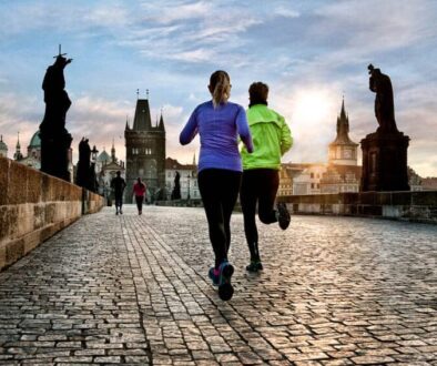 Joggers go for a morning run on Prague's Charles Bridge.